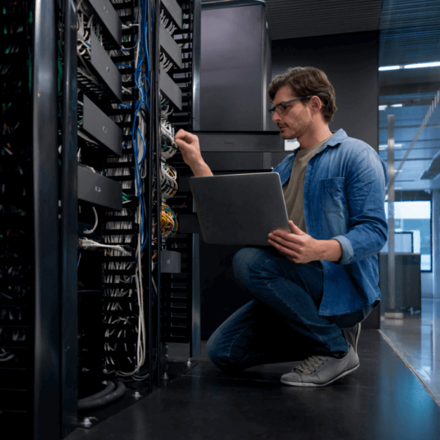 Data Center Operator Servicing Server Rack