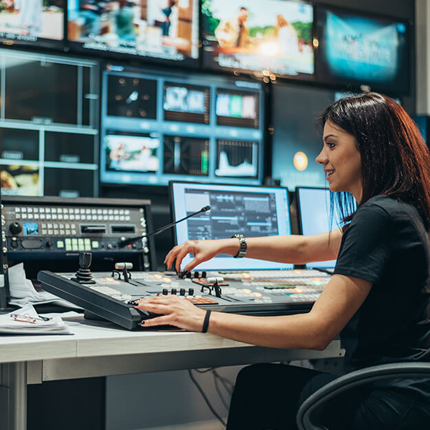Woman Working in a Broadcast Control Room